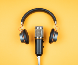 A Microphone and a headphone over a yellow background